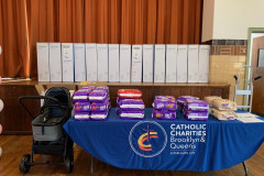 Table with packages of diapers and other baby products