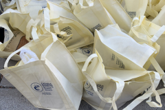 Bags-filld-with-donated-turkeys-are-piled-together-during-a-Thanksgiving-Turkey-Distribution-in-Brooklyn-NY-on-Mon.-Nov.-21-2022