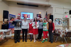 Members and staff of the Catholic Charities Pete McGuiness Older Adult Center gather for a group photo at a recent Christmas party.