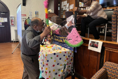An indoor game of piñata.